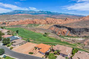 Aerial view of residential area featuring a mountain backdrop