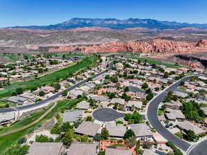 Aerial view of residential area featuring mountains
