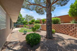 Fenced backyard featuring a patio