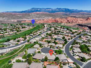 Aerial view of residential area with a mountainous background