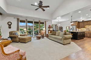 Expansive Great Room with Vaulted Ceilings and Seamless Flow to the Gourmet Kitchen.