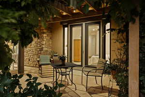Private Covered Patio—A Serene Spot for Morning Coffee or Evening Relaxation. (Entrance from the Primary Suite)