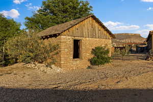View of side of home featuring stone siding and board and batten siding