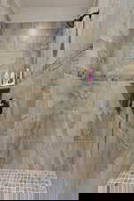 Full bath with tiled shower