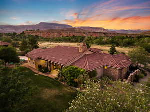 Aerial view of property and surrounding area with mountains