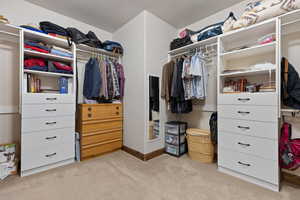 Walk in closet featuring carpet floors