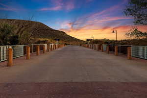 View of road with a mountain view and street lights