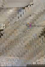 Primary Bathroom - Walk-In Tiled Shower with Premium Fixtures