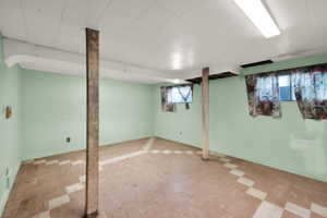 Basement featuring baseboards