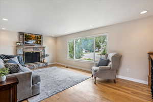 Front living room with fireplace and hardwood floors