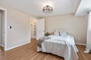 master bedroom showing walk in closet