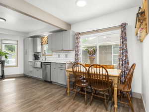 Dining space featuring wood finished floors and baseboards