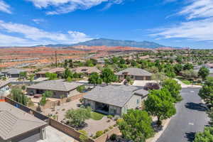 Aerial perspective of suburban area with a mountain backdrop