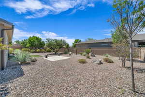 Fenced backyard featuring a patio area