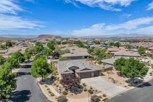 Aerial perspective of suburban area with a mountainous background