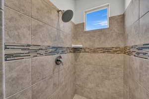 Bathroom view of a tile shower