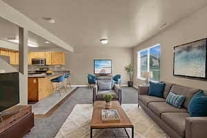 Living area featuring light tile patterned floors and baseboards