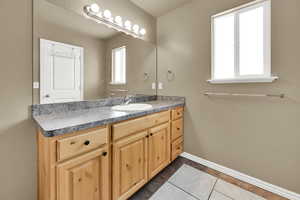 Bathroom with vanity and tile patterned floors