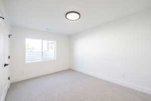 Spare room with light carpet