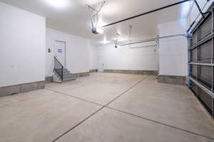 Garage featuring a garage door opener