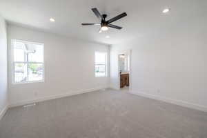 Unfurnished room with recessed lighting, light carpet, and a ceiling fan