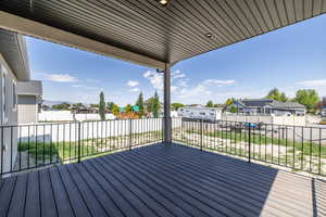 Wooden deck with a residential view