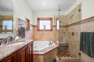 Main floor bathroom featuring an air jetted tub with LED mood lights,  separate shower with glass door coating to reduce spotting, obscured window for privacy and natural northern light