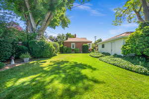 View of private backyard and garage