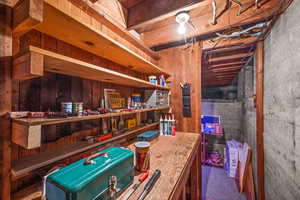 Basement workbench and utility room with  more storage area