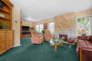 Living room with lots of northern light coming through double pane windows with top down/bottom up window shades