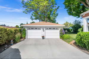Detached 528 sq ft garage with automatic openers and motion sensor on the front