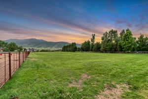 View of yard featuring a view of countryside and a mountain view