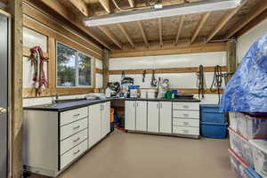 Misc room featuring finished concrete floors