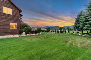 View of grassy yard featuring a mountain view