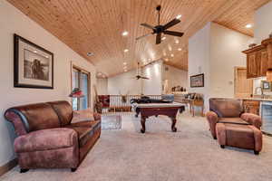 Recreation room featuring ceiling fan, carpet, billiards table, recessed lighting, and vaulted ceiling