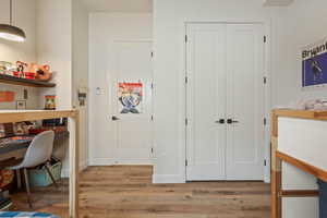 Home office with wood finished floors and baseboards