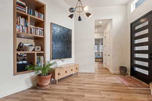 Foyer entrance featuring wood finished floors