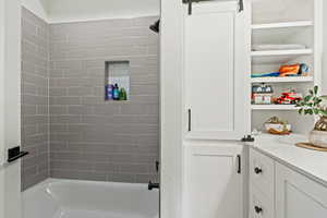 Full bathroom featuring tub / shower combination and vanity