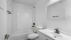 Primary Bathroom featuring vanity and washtub / shower combination