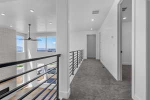Hallway featuring carpet and recessed lighting