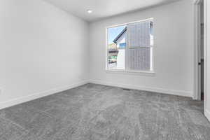 Empty room featuring carpet flooring
