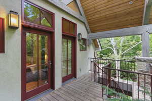 View of exterior entry featuring stucco siding