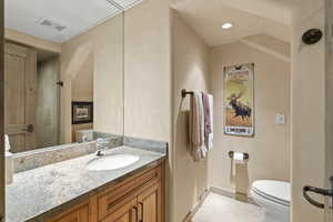 Bathroom with vanity and a shower