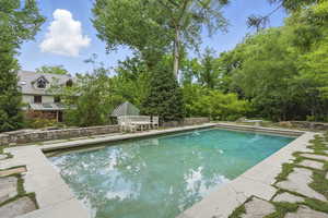 Outdoor pool featuring a patio