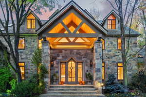 Entrance to property with stone siding