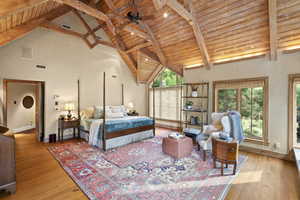 Bedroom featuring a wood ceiling with exposed beams, high vaulted ceiling, and light wood-style floors