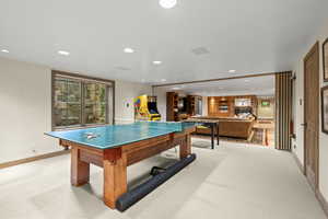Playroom with recessed lighting and light colored carpet