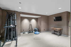 Exercise area featuring carpet floors and recessed lighting