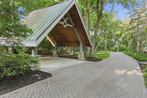 View of community featuring decorative driveway