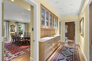 Hallway featuring light wood-style floors and recessed lighting